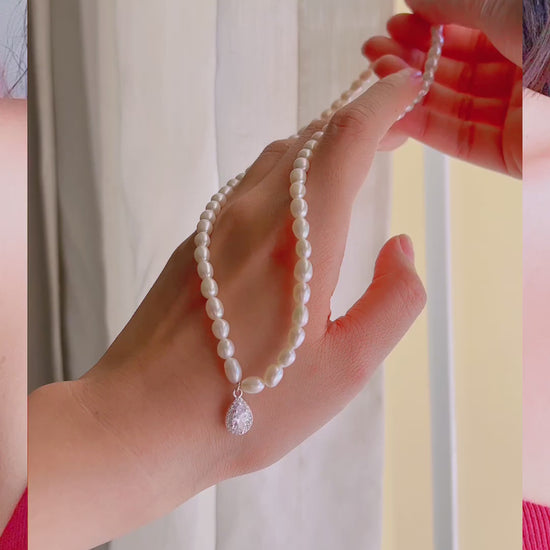 video of model wearing Adele Pearl Chain Necklace