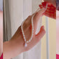 video of model wearing Adele Pearl Chain Necklace