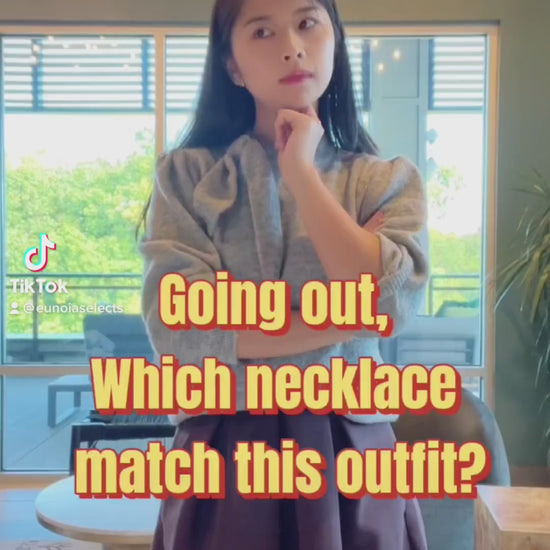 video of model wearing vintage gold coin necklace