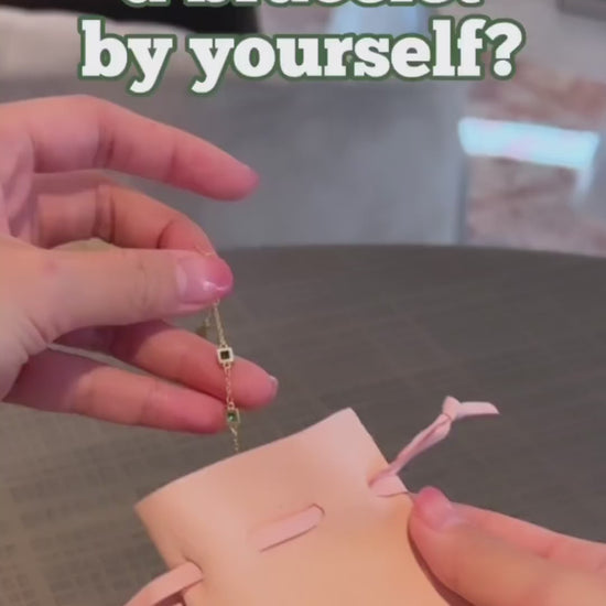 Video showing how to wear emerald green bracelet with household objects 